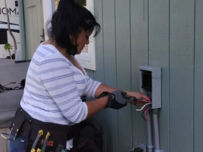 Licensed electrician wiring an exterior subpanel in Lolo