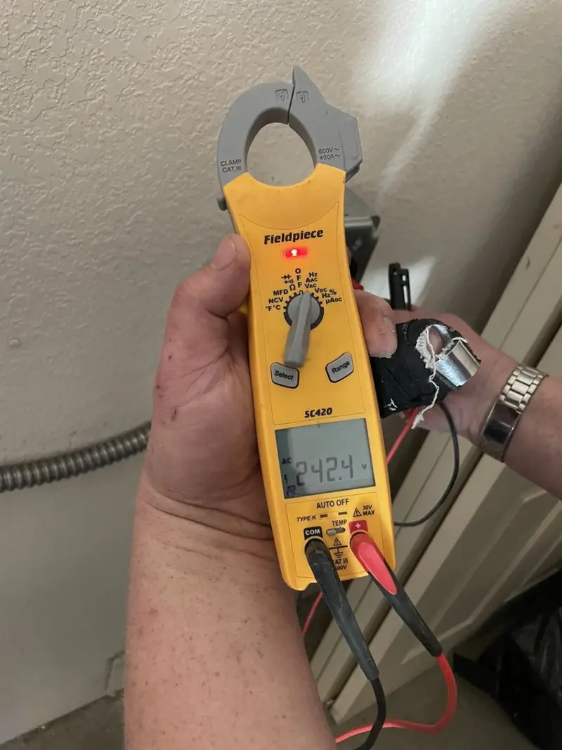 Voltage testing with clamp meter during Whole House Surge Protector in Lolo
